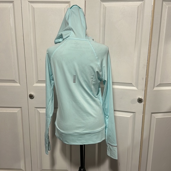 Women's UA OutRun The Cold Hooded ½ Zip in “Fuse Teal” - Picture 8 of 11